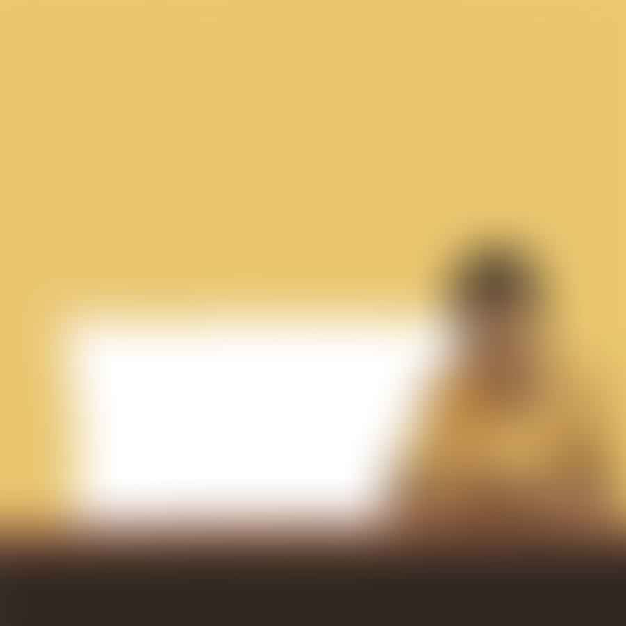 A person staring at a blank document, pondering how long their essay should be