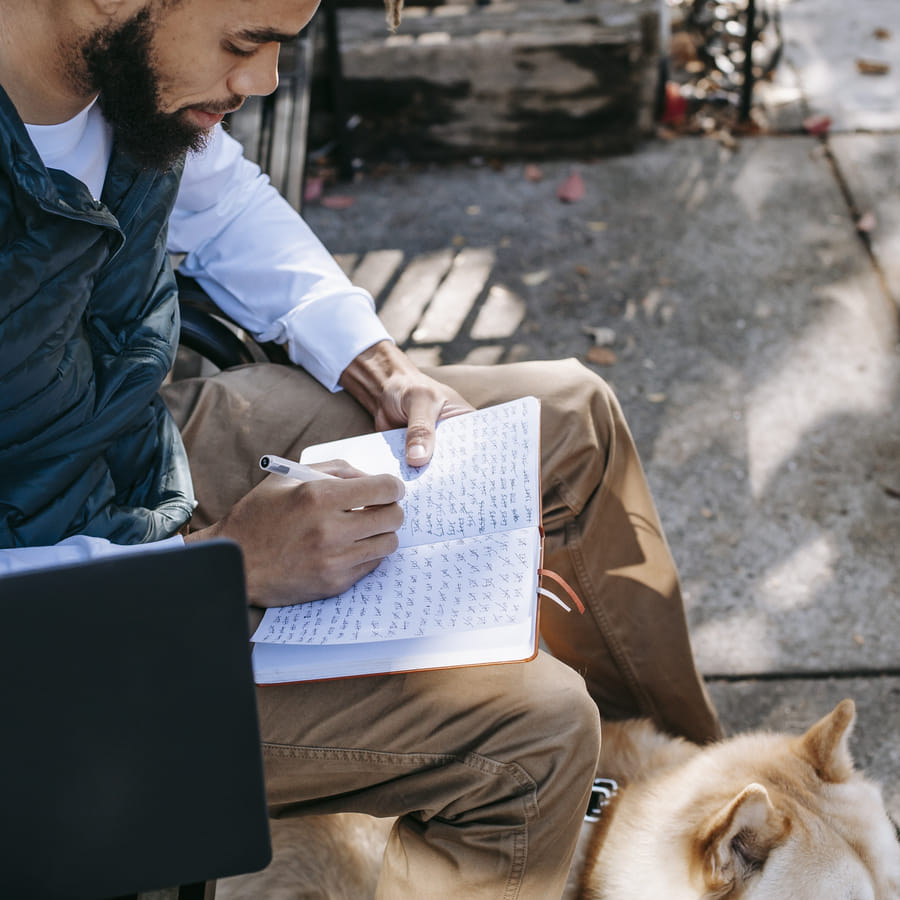 Student deeply immersed in writing an informative essay